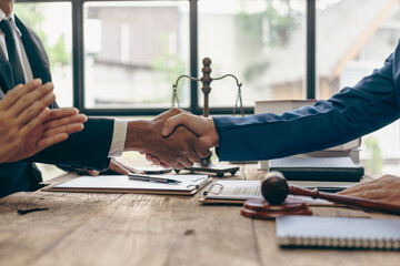 Handshaking legal consultant agreement, lawyer contract advising on litigation and handshaking contract as a lawyer to receive complaints from clients, lawyer, close-up image