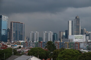 Fototapeta na wymiar Image of tall buildings in a cloudy sky