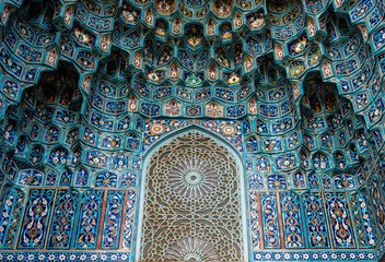 The wall of the mosque with colored mosaics.