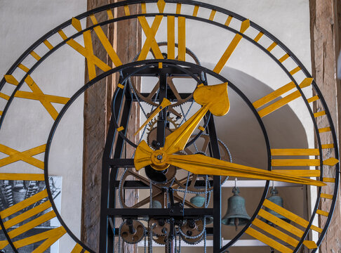 Antique clock with Roman numerals close-up.