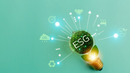 ESG with on lightbulb earth decrease CO2 or carbon dioxide emission, carbon footprint and carbon...