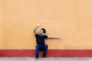 9-year-old dark-skinned Latino boy uses hearing aids that alter learning, memory and retention...