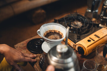 Drip coffee,coffee dripper and hands barista make coffee