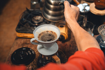 Drip coffee,coffee dripper and hands barista make coffee