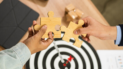 businessman holds in hand a jigsaw puzzle. Business solutions, success and strategy concept. Two...