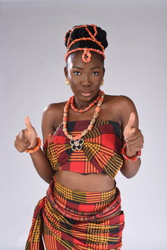 Young black African Nigerian igbo looking gorgeous wearing native attire  holding up thumbs closer up focused at the camera