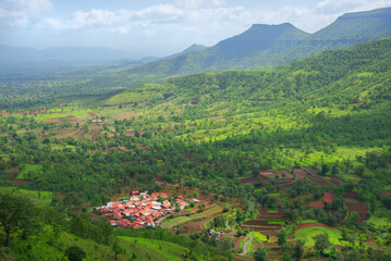 Obraz premium Small village in the valley. Colorful landscape. Drama of light and shadows.