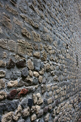 View of typical Roman brick and mortar wall on a rainy morning