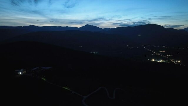 Drone flight over a castle on top of the hill at dusk
