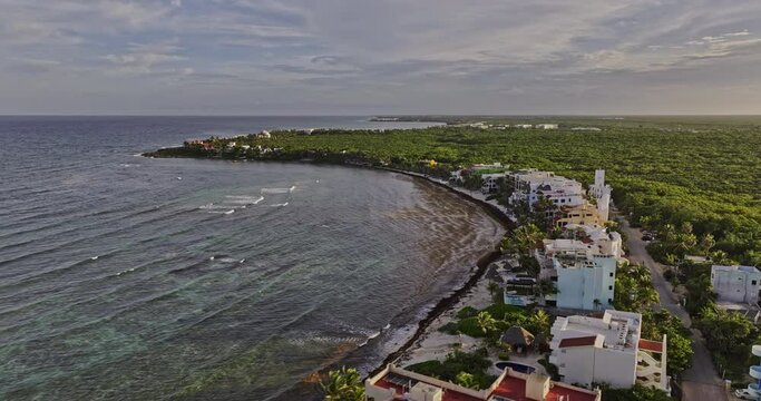 Akumal Mexico Aerial v9 drone fly along coastline capturing seafront vacation homes, resort hotels, lush landscape of tropical plantations and ocean views - Shot with Mavic 3 Pro Cine - July 2023