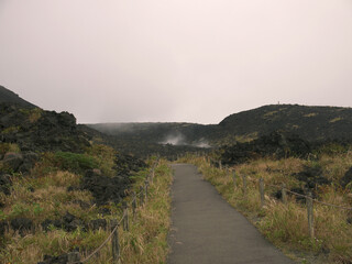 Walking by Footpath on Mihara volcano with volcanic landscape valley view, Izu Oshima island, Japan