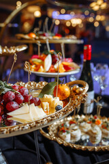 Delectable treats beautifully displayed on golden platters at a party