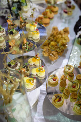 Catering Buffet with a Variety of Heart-Shaped Appetizers and Pastries on Mirrored Platters