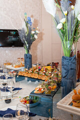 Elegant buffet spread with sandwiches, salads, and snacks for special events or gatherings