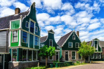 Fototapeta na wymiar Street with traditional wooden houses in the historic village of Zaanse Schans