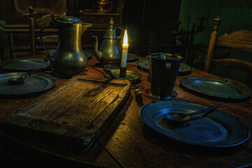 Pewter chinaware, on an antique table