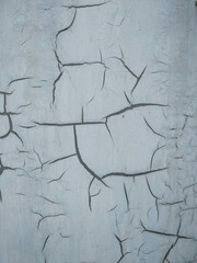 a white wall with cracks on it