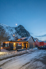 Fototapeta na wymiar norway lofoten islands winter season snow covered landscapes beaches cloudy sky and colorful houses
