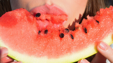 Close up photo of tasting slice on watermelon. Juicy fruity lip, Summer watermelon. Woman sensual...