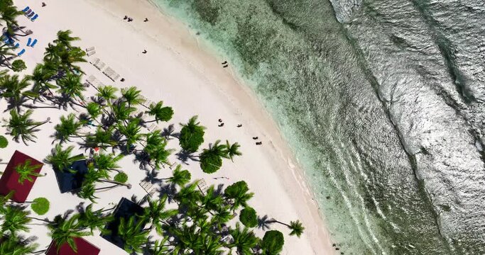 Paradise exotic vacation on a tropical island beach in Dominican Republic, aerial top view above sea shore in Punta Cana