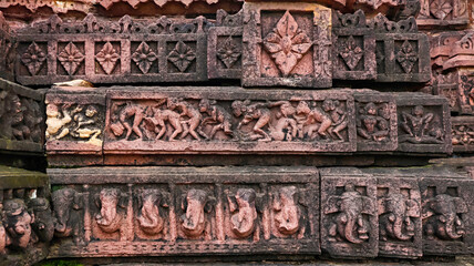 Erotic Carvings, Flower and Elephant Panels on the Char Khamba Jain Temple, Peenjana, Baran, Rajasthan, India.