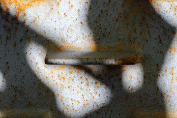 Abstract composition with a rusted metal plate. Light and shadows.
