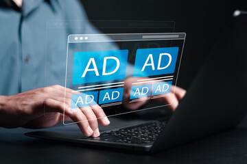 Digital marketing and online advertising to targeted customers. Businessman use laptop with ADs on website. Shooting ads on cross feeds to optimize customer engagement.