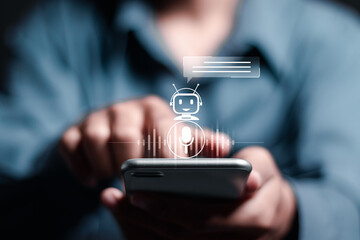 AI Chatbot intelligent digital customer service. Businessman use smartphone with Chatbot application for artificial intelligence automatically respond to online messages to help customers instantly.