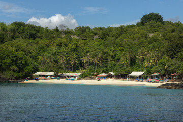 Fototapeta na wymiar Scenic secluded white sand Bias Tugel beach next to Padang Bai bay on Bali island