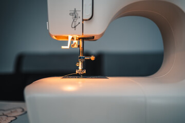 sewing machine on with light ready to work