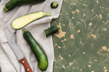 Fresh zucchini on green background