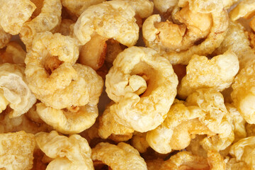 Closeup of pork snack or pork rinds, deep fried pork skin and blistered is traditional food in the...