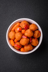 Delicious fried potato balls with vegetables, salt, spices and herbs