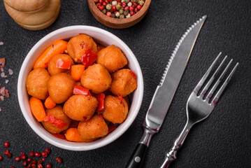 Delicious fried potato balls with vegetables, salt, spices and herbs