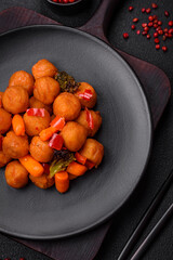 Delicious fried potato balls with vegetables, salt, spices and herbs
