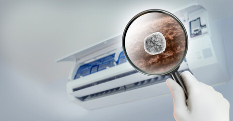 Look through the magnifying glass to the Particle of dust and dirt inside of an air conditioner....