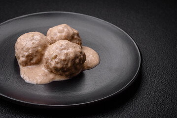 Delicious meatballs from minced chicken or turkey with sour cream sauce