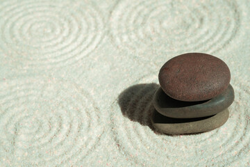 Top view of background and backdrop on sand The concept of balancing stones in a Japanese Zen garden