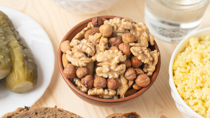 A mixture of nuts and cereal porridge on a wooden table, healthy and wholesome food concept