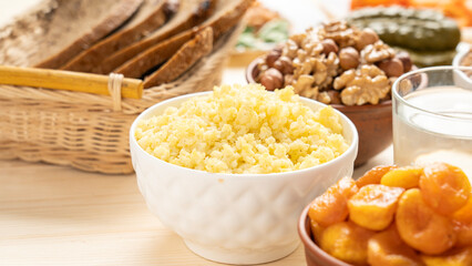 A mixture of nuts and cereal porridge on a wooden table, healthy and wholesome food concept