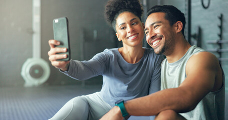 Fototapeta premium Asian man, woman or phone selfie in gym workout, training or exercise for social media, health app or fitness vlog. Smile, happy or bonding exercise friends or people on mobile photography technology