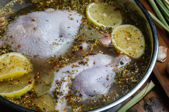 Chicken soaked in salt water brine with lemon, herb and spice