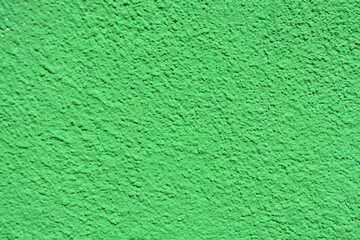 The closeup wall surface is painted green