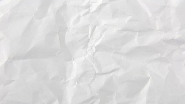 Stop motion animated crumpled white paper texture background.
