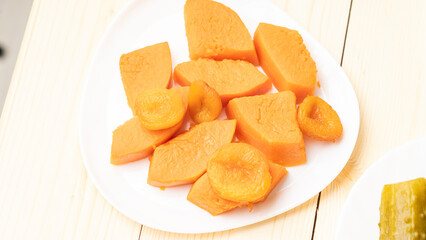 Slices of baked pumpkin on a plate
