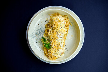 Carbonara pasta with cream and cheese in a plate