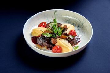 Stewed veal cheeks with mashed potatoes and vegetables