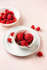 Raspberry sorbet scoops in a plate