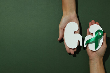 Kidney moon concept, kidneys on a green background.