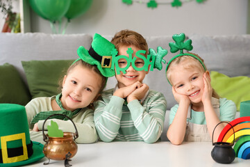 Cute kids celebrating St. Patrick's Day at home party